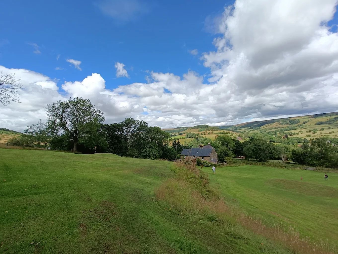 Man walking down fairway at rosedale abbey golf course