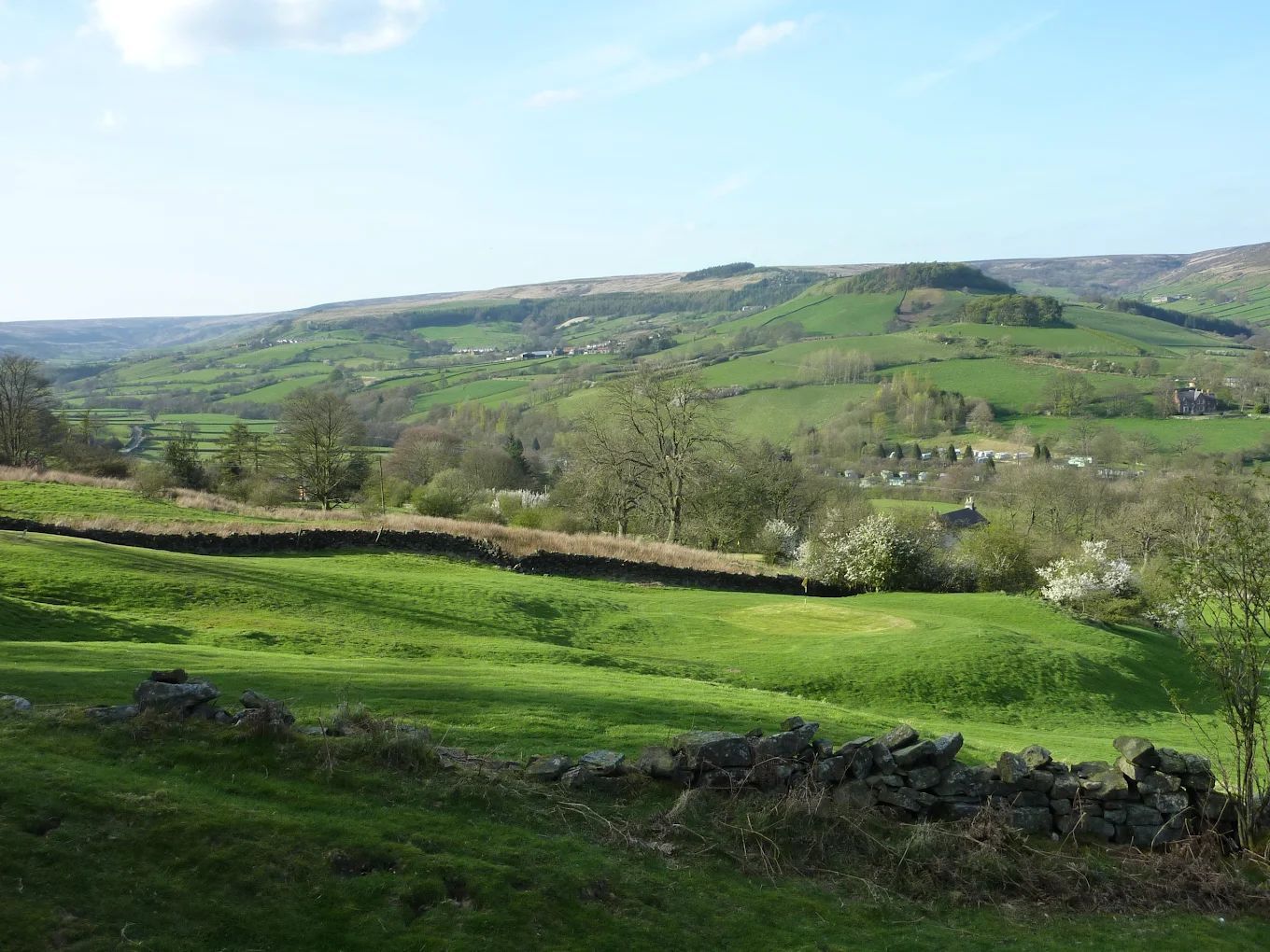 View of rosedale abbey golf course from stone wall
